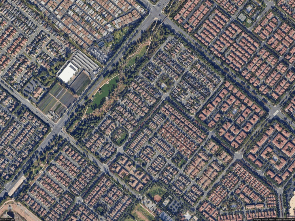 California real estate houses in suburban area with roads and greenery